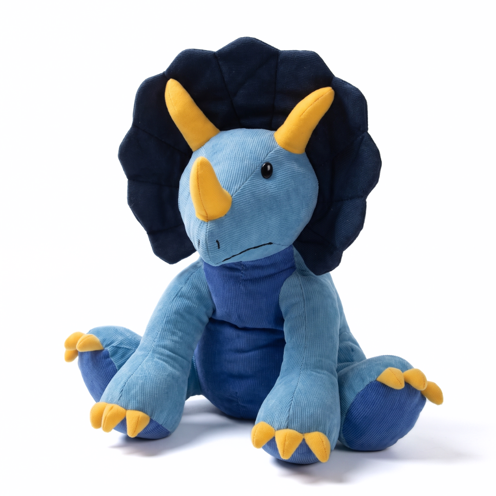 Détail de la texture douce de la peluche dinosaure